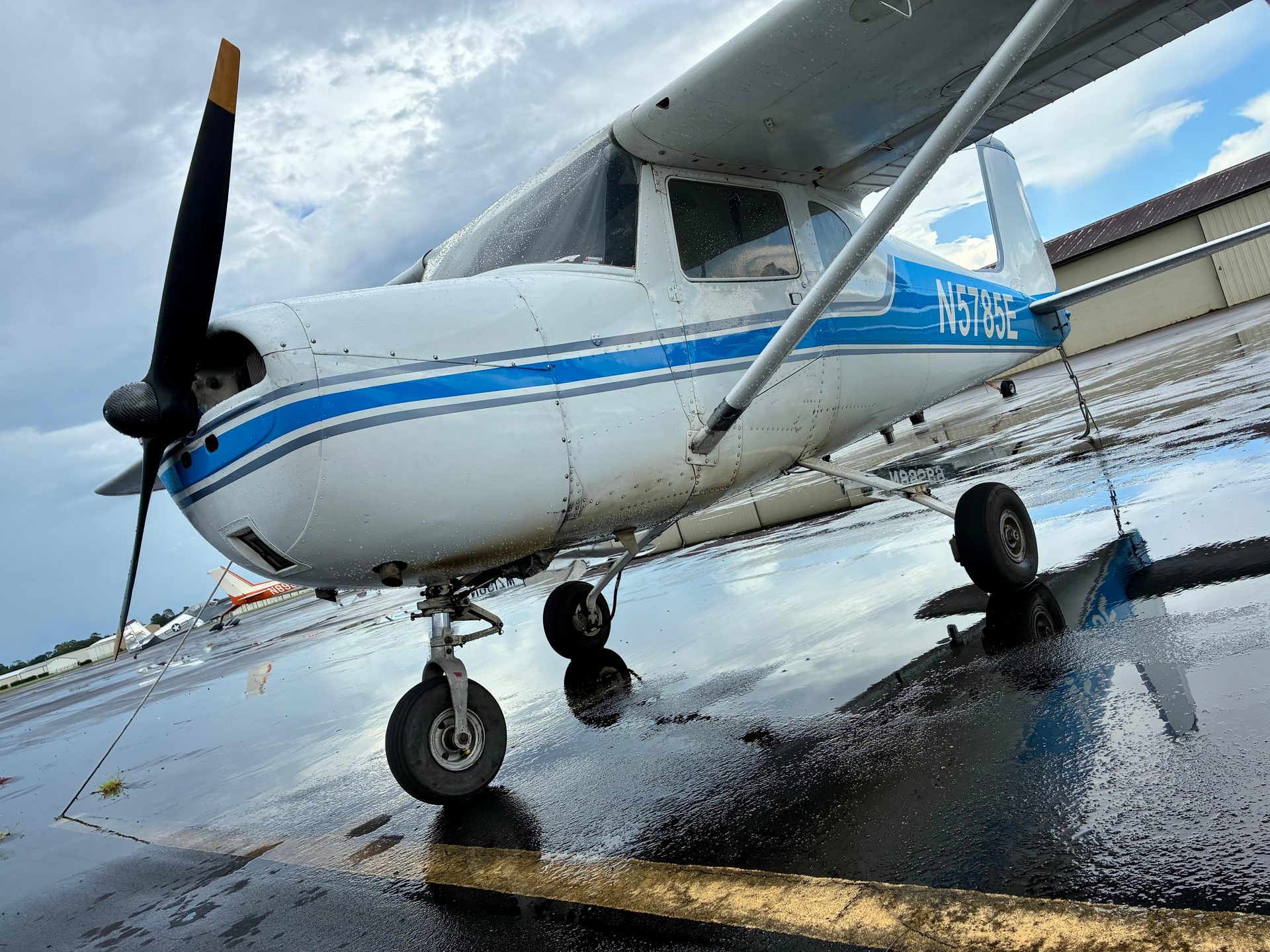 Nose-on view of Cessna 150 N5785E on the ramp